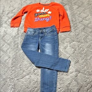 Vigors Blue Jeans and Orange Sweatshirt